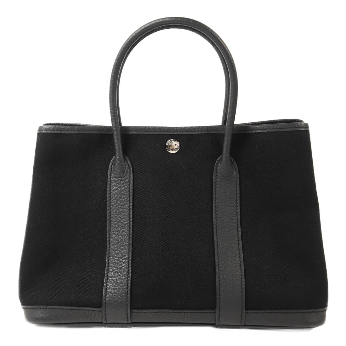 Garden Party TPM Black Canvas Tote with Palladium Hardware by Hermes: Garden Party TPM Black Canvas Tote with Palladium Hardware by Hermes This Hermes Garden Party TPM tote bag is crafted from black canvas and features palladium-plated hardware. Designed for women, it o