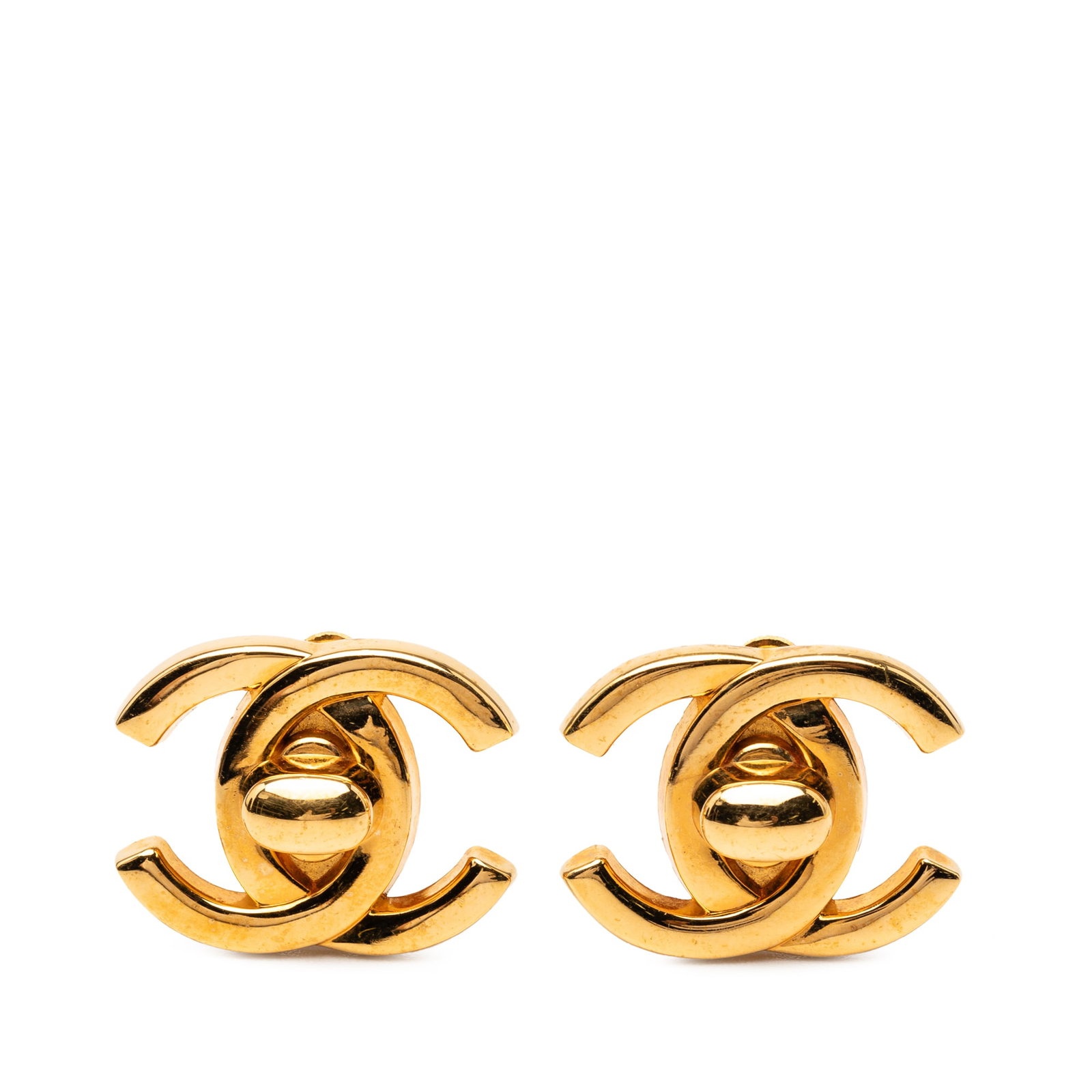 Chanel CC Turn Lock Clip-On Earrings Gold Plated Metal: Chanel CC Turn Lock Clip-On Earrings Gold Plated Metal These Chanel clip-on earrings feature a gold-plated metal body with the iconic CC turn lock design. Made in France, these costume earrings displa