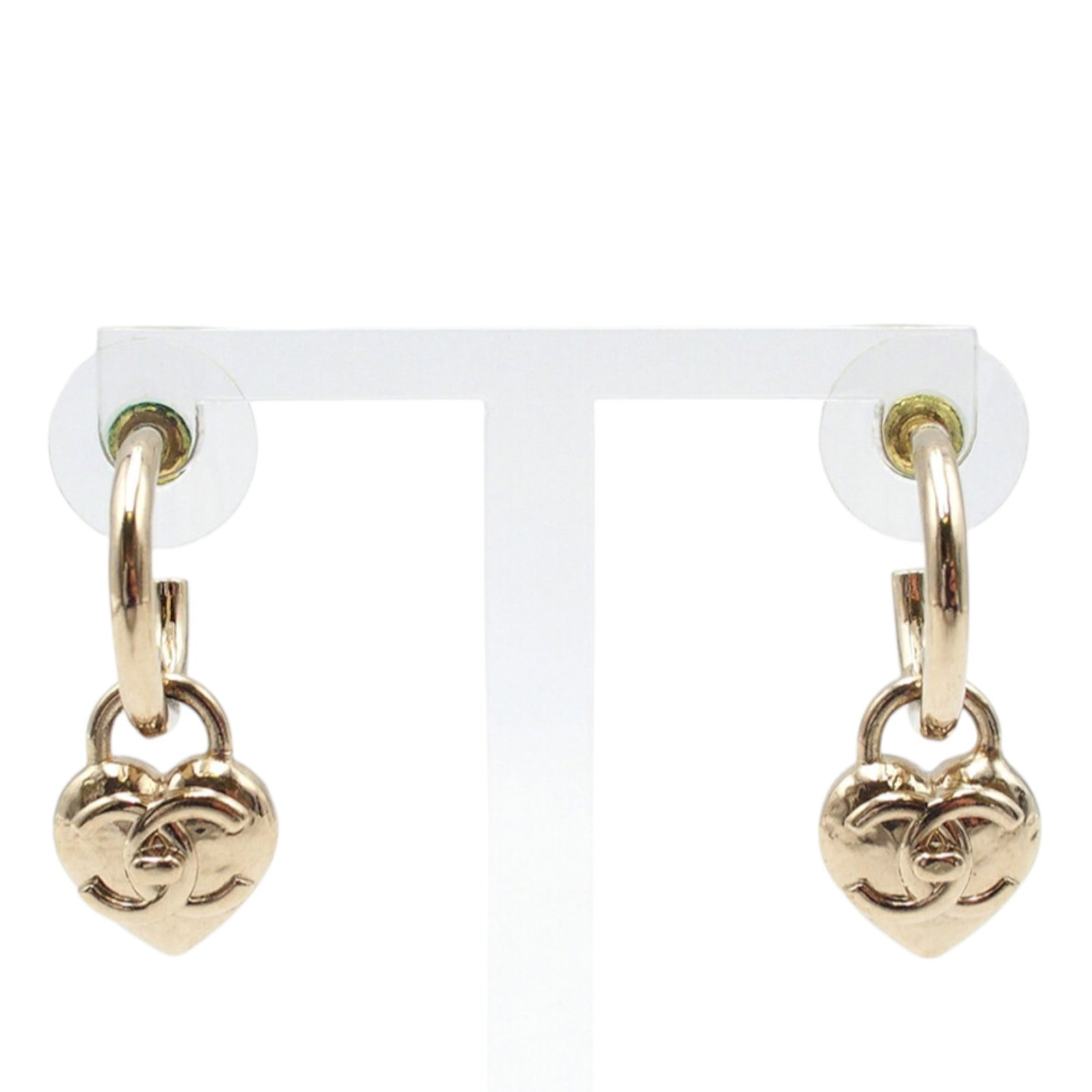 Chanel Heart Hoop Earrings with CC Turnlock Gold Tone Metal Push Back: Chanel Heart Hoop Earrings with CC Turnlock Gold Tone Metal Push Back These Chanel heart hoop earrings feature a gold-tone metal construction with the iconic CC turnlock design and push back closures.