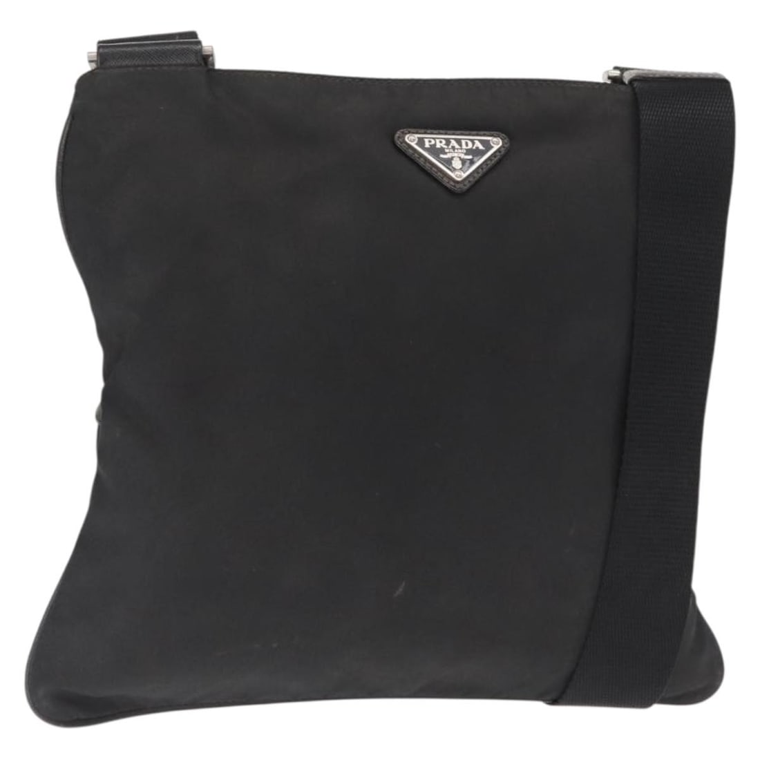 Prada Black Nylon Shoulder Bag with Silver Details Made in Italy: Prada Black Nylon Shoulder Bag with Silver Details Made in Italy This PRADA shoulder bag is crafted from black nylon with silver-tone accents. It features an adjustable shoulder strap and a spacious i