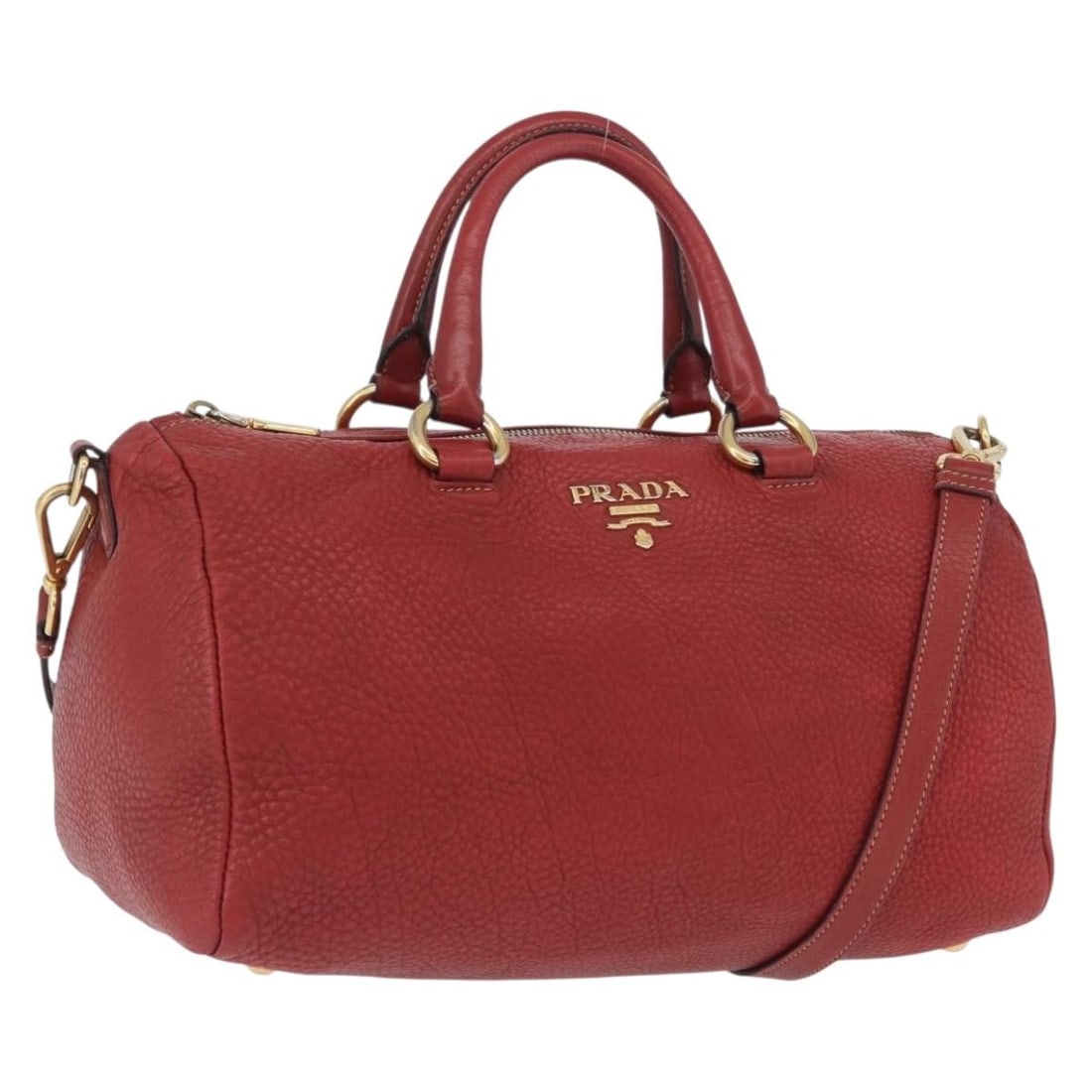Red Leather PRADA Two-Way Shoulder and Handbag with Gold Accents: Red Leather PRADA Two-Way Shoulder and Handbag with Gold Accents This PRADA handbag is crafted from red leather with gold-tone accents and can be carried by hand or worn as a shoulder bag with the inc