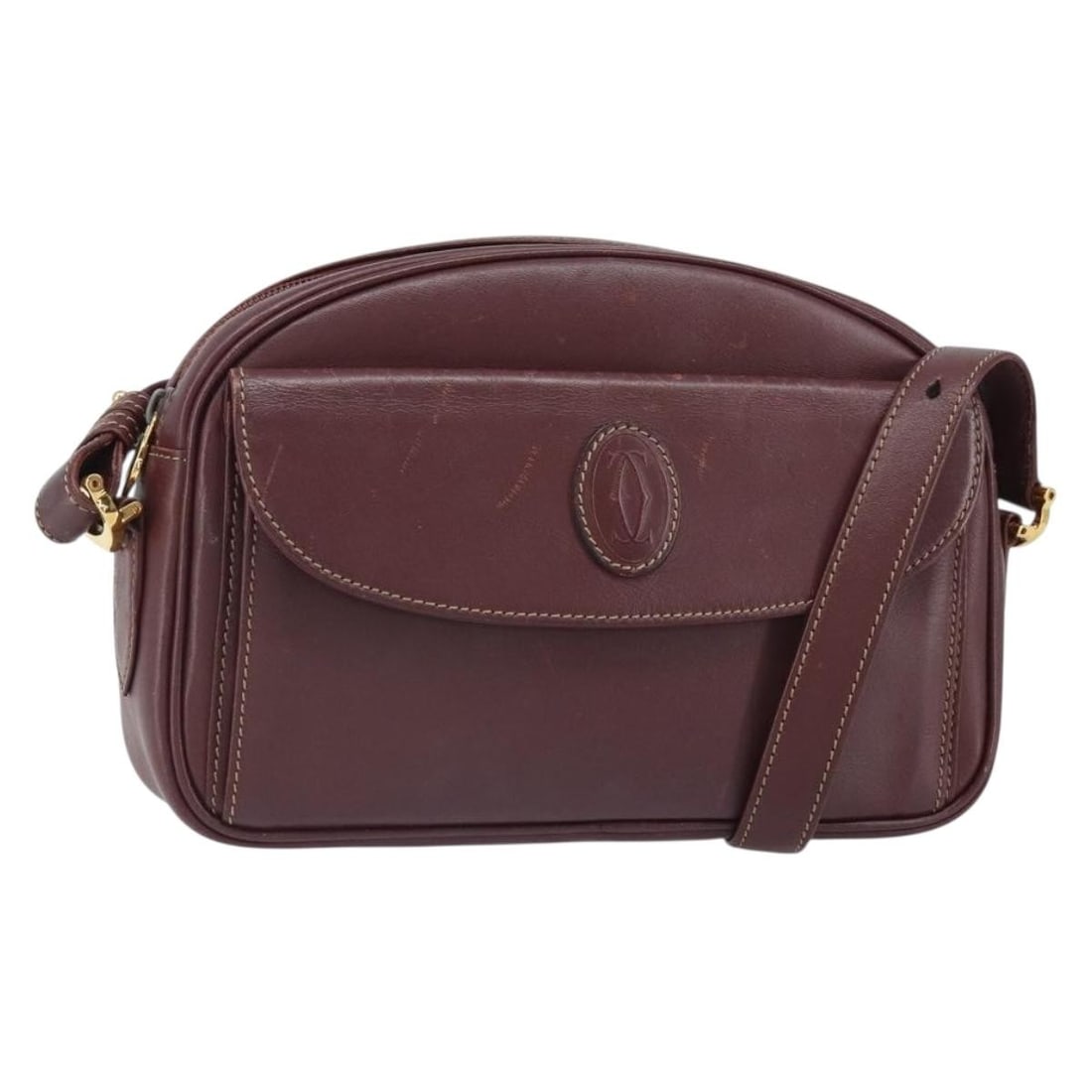 Cartier Must Line Bordeaux Leather Shoulder Bag with Gold Accents: Cartier Must Line Bordeaux Leather Shoulder Bag with Gold Accents This Cartier Must Line shoulder bag is crafted from Bordeaux leather with gold-tone accents. Made in Spain, it features a compact desi