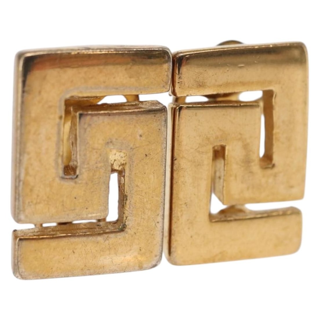 Gold Tone Metal Earring by Gianni Versace Italian Designer Jewelry: Gold Tone Metal Earring by Gianni Versace Italian Designer Jewelry This authentic Gianni Versace earring features a gold-tone metal construction and classic design. Made in Italy, it displays signs of