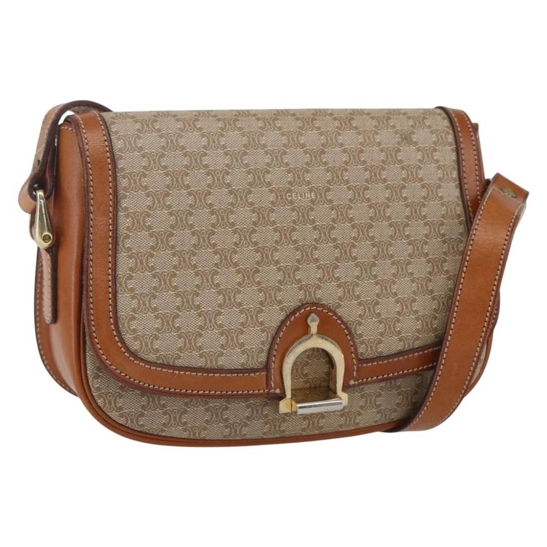 Beige Gold Macadam Canvas Shoulder Bag by CELINE PVC Leather: Beige Gold Macadam Canvas Shoulder Bag by CELINE PVC Leather This CELINE Macadam Canvas Shoulder Bag features a beige PVC leather exterior with gold-tone hardware. Designed in France, the shoulder bag