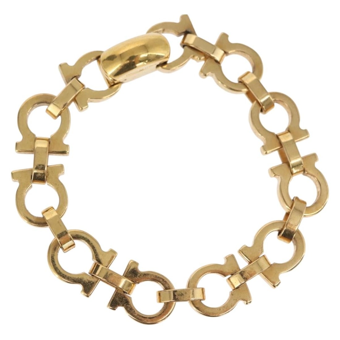 Salvatore Ferragamo Gold Tone Metal Women's Bracelet 7.9 Inch Made in Italy: Salvatore Ferragamo Gold Tone Metal Women's Bracelet 7.9 Inch Made in Italy This women's bracelet by Salvatore Ferragamo features a gold-tone metal design. Made in Italy, the bracelet measures approxi