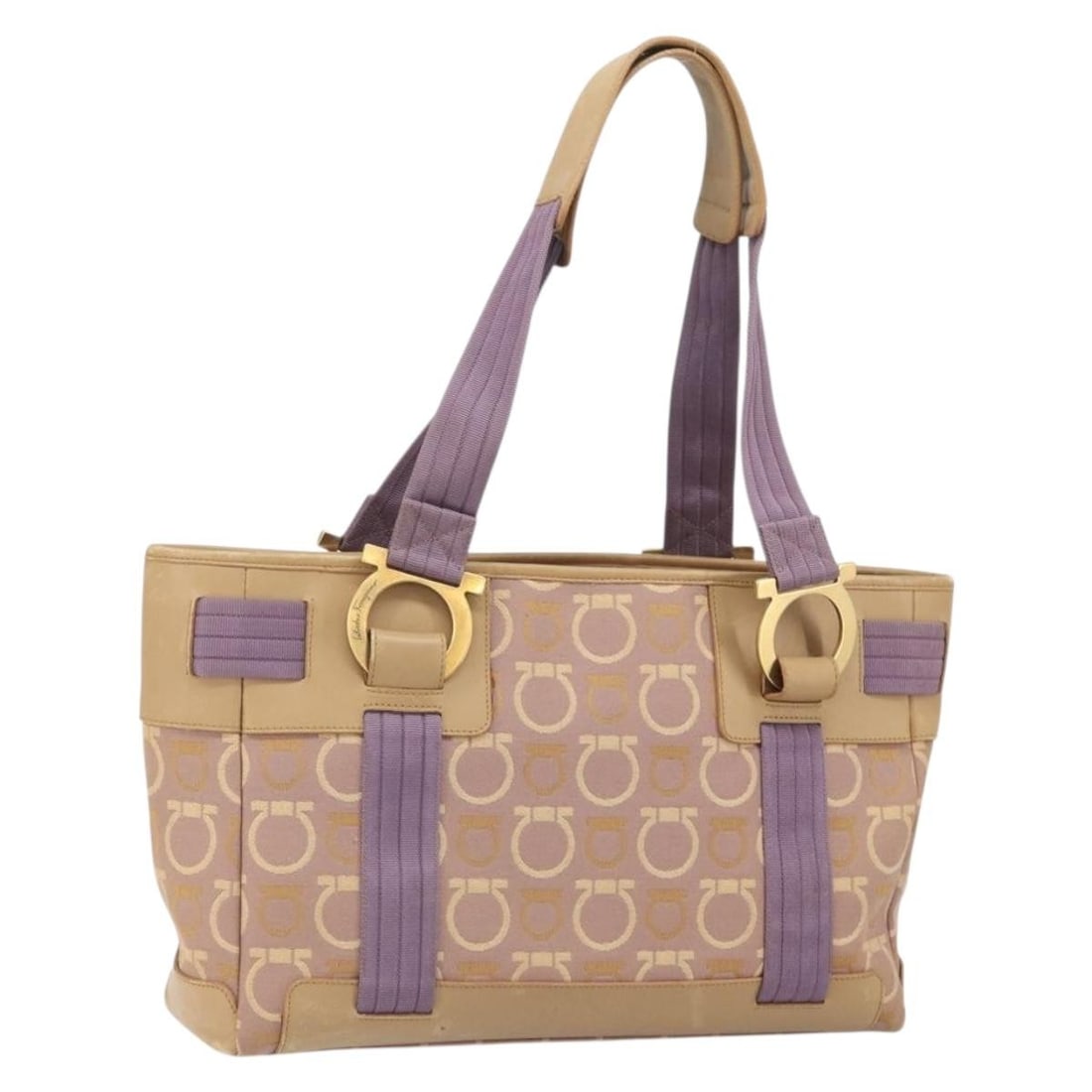 Purple Canvas Gancini Tote by Salvatore Ferragamo Gold Accents: Purple Canvas Gancini Tote by Salvatore Ferragamo Gold Accents This Salvatore Ferragamo Gancini tote bag features a purple and gold canvas exterior and is designed for women. Crafted in Italy, the bag