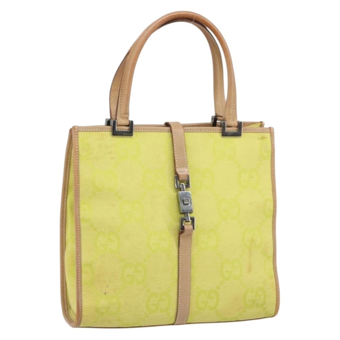 Yellow GG Canvas Jackie Handbag by Gucci Model 002 1065 Silver Accents: Yellow GG Canvas Jackie Handbag by Gucci Model 002 1065 Silver Accents This is a Gucci Jackie GG Canvas handbag featuring a yellow and silver color scheme. The exterior is crafted from GG canvas and c
