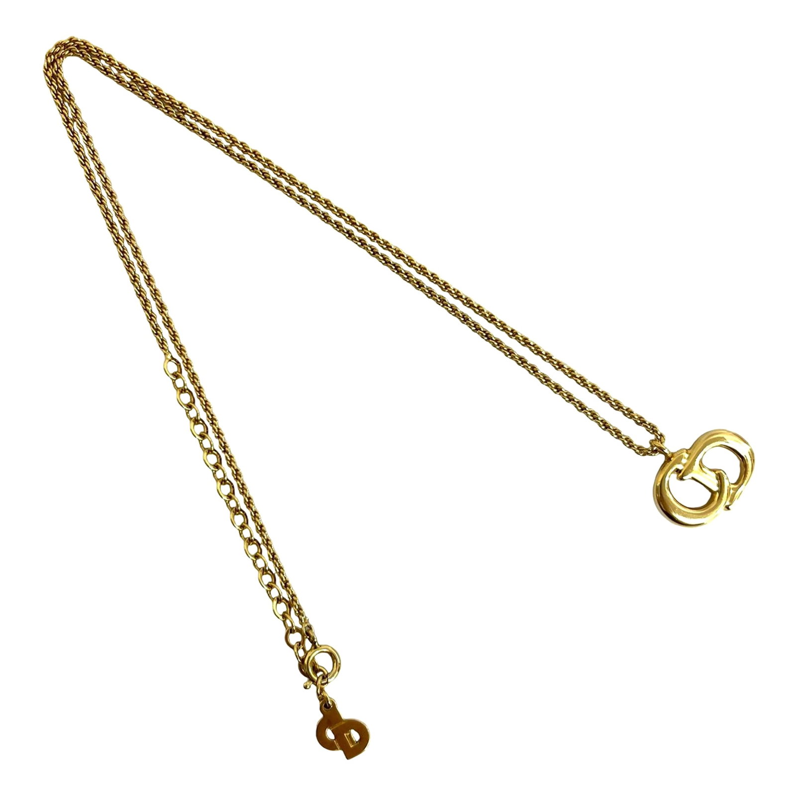 Gold Tone Pendant Necklace with CD Motif by Dior: Gold Tone Pendant Necklace with CD Motif by Dior This Dior necklace features a gold plated metal body with a signature CD logo pendant and a spring ring closure. The motif measures approximately 1.70
