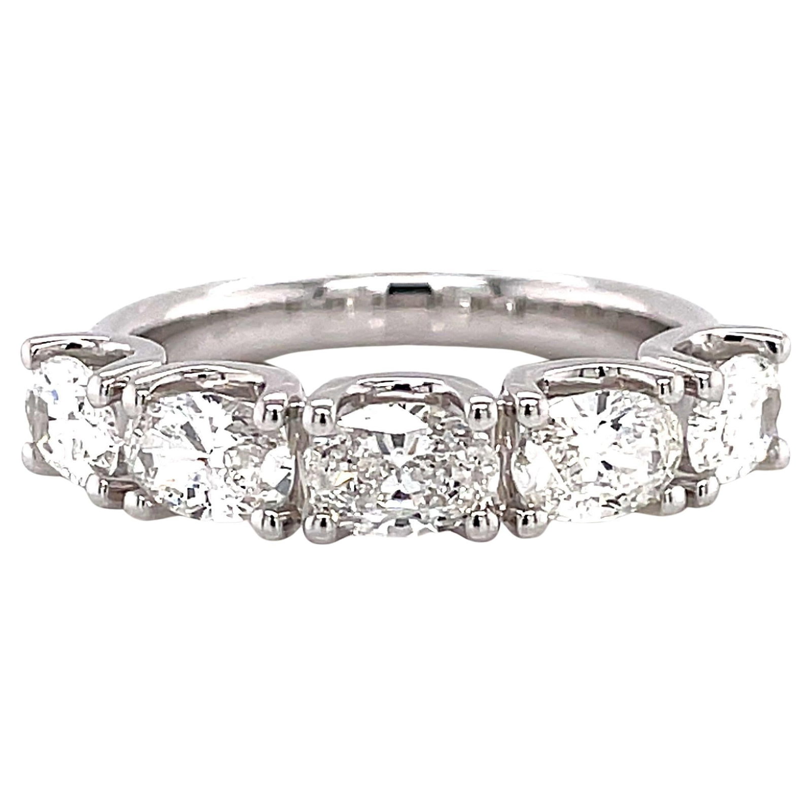 1.63ct Oval Diamond Half Eternity Ring 18k: 1.63ct Oval Diamond Half Eternity Ring 18k This stunning half eternity band features five exquisite oval cut diamonds totaling 1.63 carats, showcasing F/G color and VS clarity. Crafted from high-quali