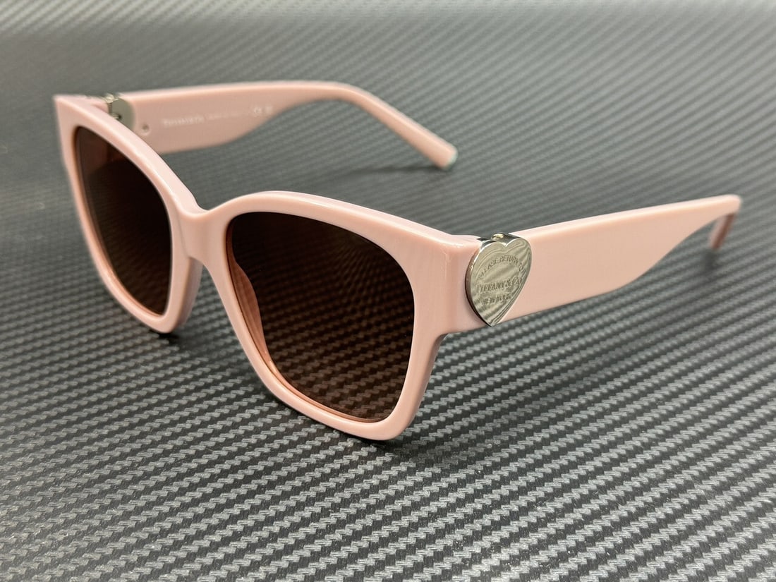 Tiffany TF4216 839313 Women's Dusty Pink Gradient Sunglasses: Tiffany TF4216 839313 Women's Dusty Pink Gradient Sunglasses Experience elegance with the Tiffany TF4216 sunglasses, featuring a stylish dusty pink frame that perfectly complements the pink gradient l