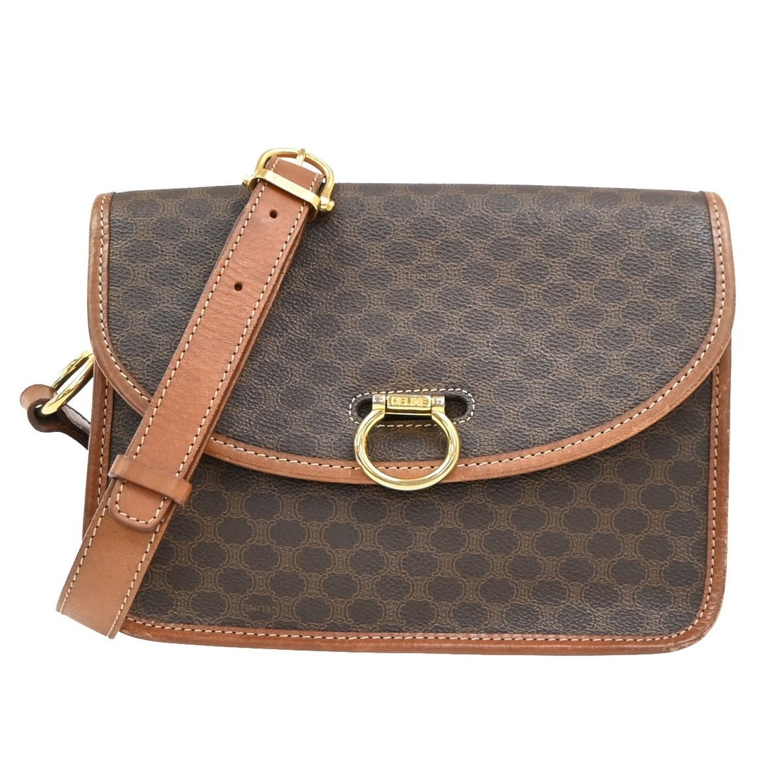 Vintage Macadam Canvas and Leather Shoulder Bag by Celine: Vintage Macadam Canvas and Leather Shoulder Bag by Celine This vintage Celine Macadam shoulder bag combines canvas and leather materials in a brown color designed for female use. Made in Italy, it fea