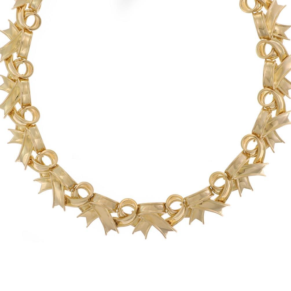 Tiffany & Co. Vintage 18k Yellow Gold Ribbon Bow Collar Necklace: Tiffany & Co. Vintage 18k Yellow Gold Ribbon Bow Collar Necklace This stunning vintage collar necklace from Tiffany & Co. is a true statement piece. Crafted from luxurious 18k yellow gold, it features