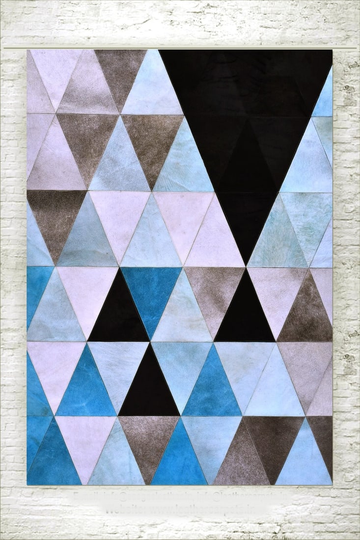 Contemporary Triangle Patchwork Cowhide Leather Rug 3ft x 5ft Handcrafted: Contemporary Triangle Patchwork Cowhide Leather Rug 3ft x 5ft Handcrafted Free continental US Shipping This contemporary rug features a geometric triangle patchwork design, expertly handcrafted from 1