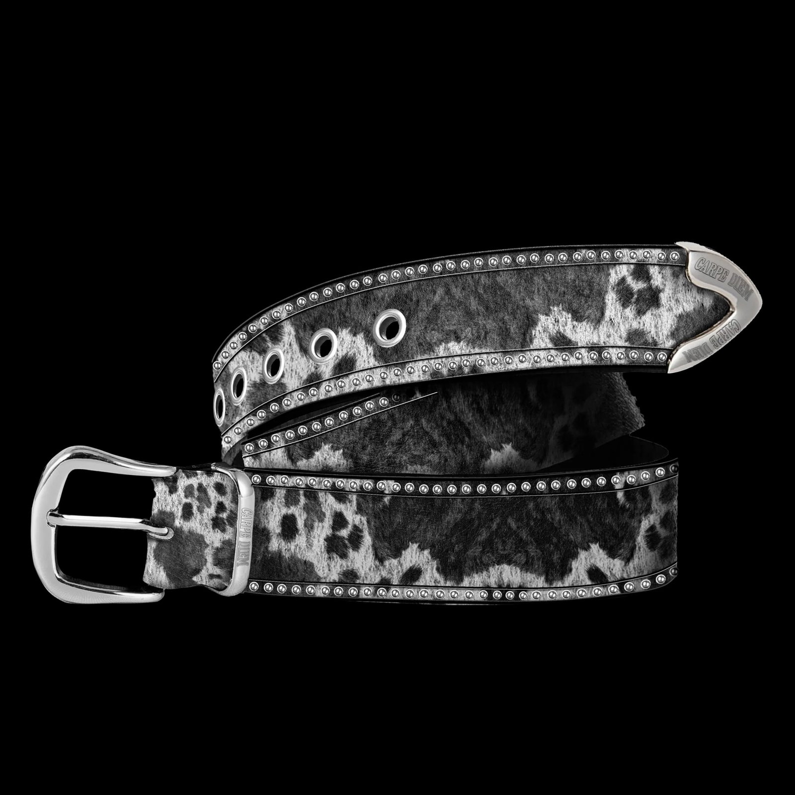 Cow Print Pony Hair Leather Belt with Silver Buckle by Carpe Diem: Cow Print Pony Hair Leather Belt with Silver Buckle by Carpe Diem This Carpe Diem belt features a genuine leather base finished with soft pony hair and a bold black and white cow print design. It is a