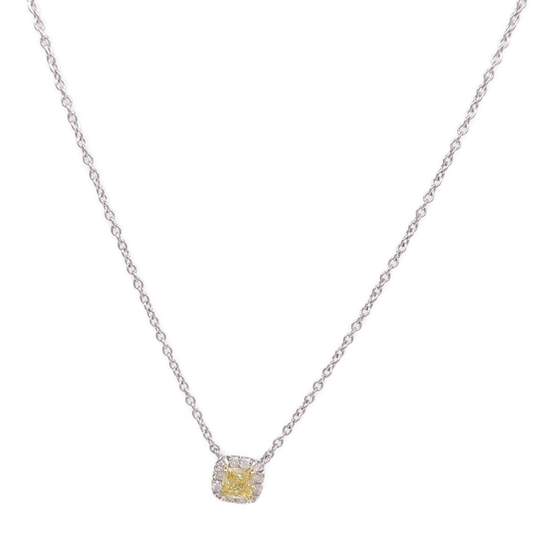 Diamond Pendant Necklace in Platinum and 18K Yellow Gold by Tiffany & Co.: Diamond Pendant Necklace in Platinum and 18K Yellow Gold by Tiffany & Co. This Tiffany & Co. necklace features a diamond set in Pt950 platinum with 18K yellow gold accents. Designed for women, the pie