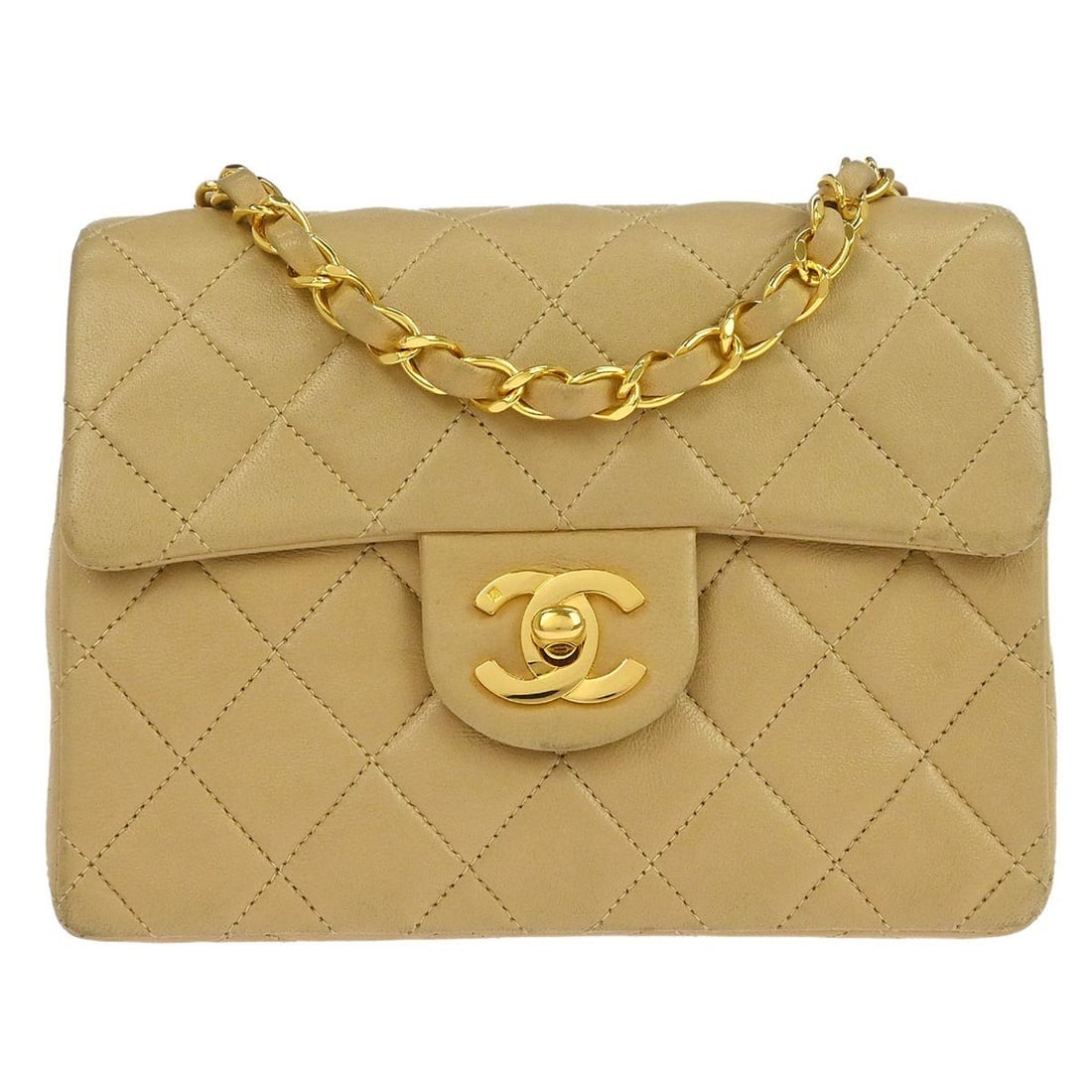 Mini Classic Square Lambskin Flap Bag Beige Crossbody by Chanel: Mini Classic Square Lambskin Flap Bag Beige Crossbody by Chanel This Chanel Mini Classic Square Flap Shoulder Bag is crafted from beige lambskin leather and features a crossbody strap and turn lock cl