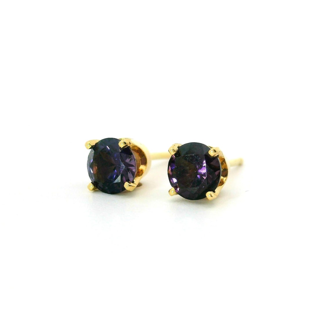 14k Yellow Gold Purple Spinel 5.10mm Stud Earrings Prong Set: 14k Yellow Gold Purple Spinel 5.10mm Stud Earrings Prong Set These stunning stud earrings feature a classic design crafted from 14k yellow gold. Each earring is prong set with a natural genuine purple