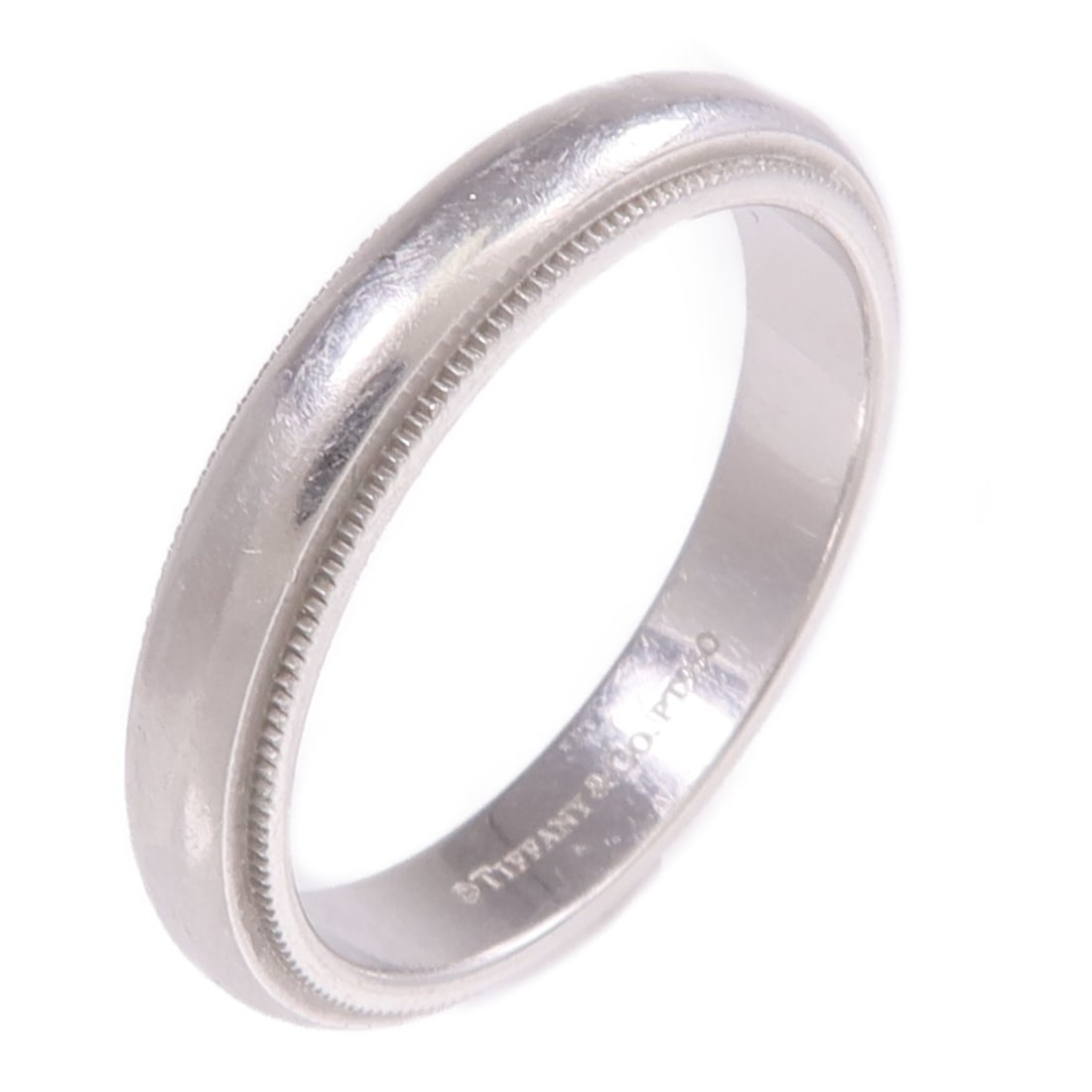 Milgrain Band in Pt950 Platinum by Tiffany & Co Size 7.75: Milgrain Band in Pt950 Platinum by Tiffany & Co Size 7.75 This Tiffany & Co. Milgrain ring is crafted from PT950 platinum and features a classic silver tone. Designed for unisex wear, the ring is a si