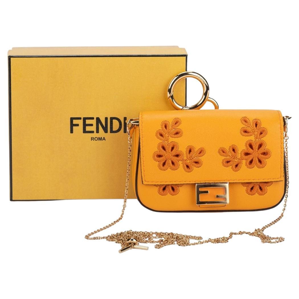 Fendi Baguette Bag Charm Floral Clementine Gold Hardware NIB: Fendi Baguette Bag Charm Floral Clementine Gold Hardware NIB This exquisite Fendi Baguette Bag Charm is a stunning accessory that embodies luxury and style. Crafted in Italy, this charm features flora