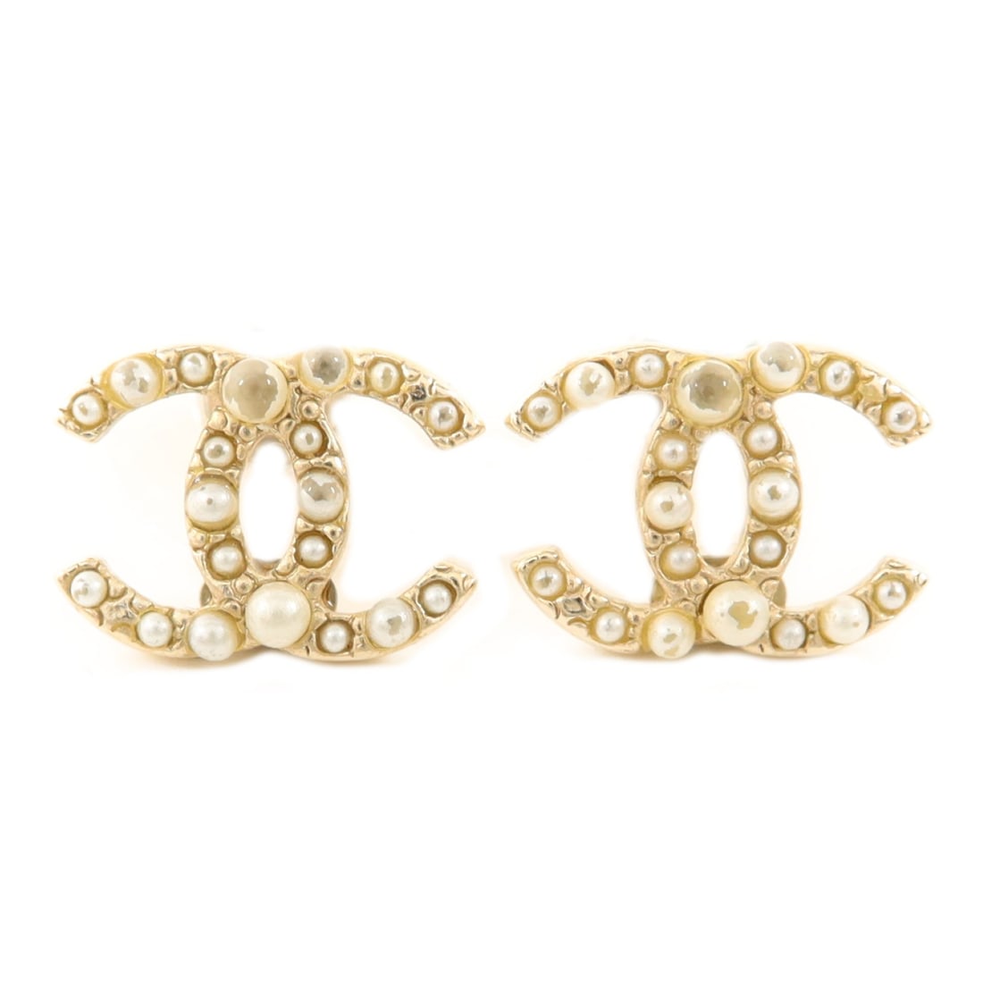 Gold and White CC Logo Pierced Earrings by CHANEL: Gold and White CC Logo Pierced Earrings by CHANEL These CHANEL CC pierced earrings feature a combination of PVC and metal in gold and white tones. Designed with the iconic CC logo, they are crafted in