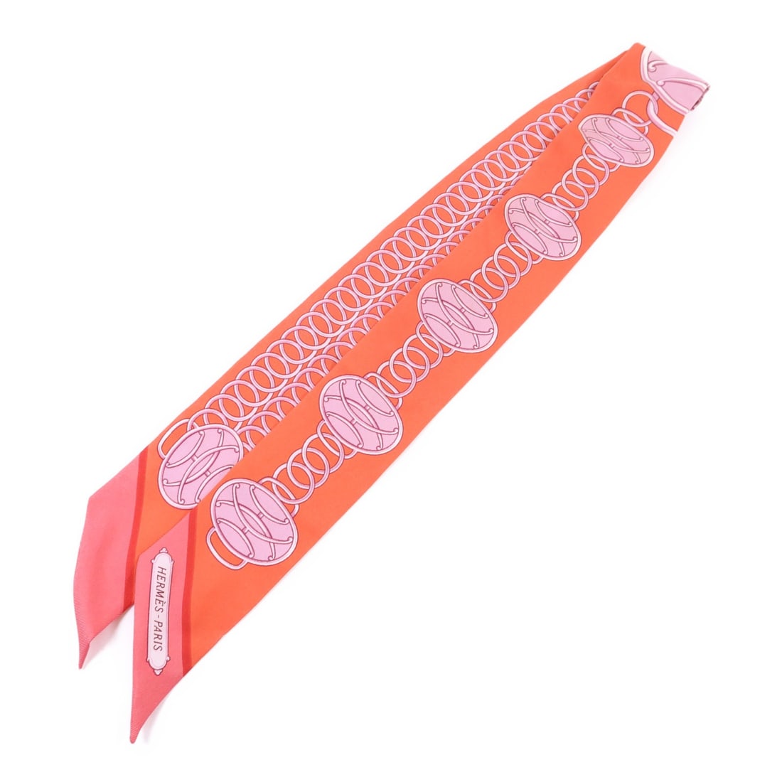 Red Silk Twilly Scarf by Hermes France: Red Silk Twilly Scarf by Hermes France This Hermes Twilly scarf is crafted from silk and features a striking red color. Made in France, it is designed in a regular size and shows reasonable wear and t