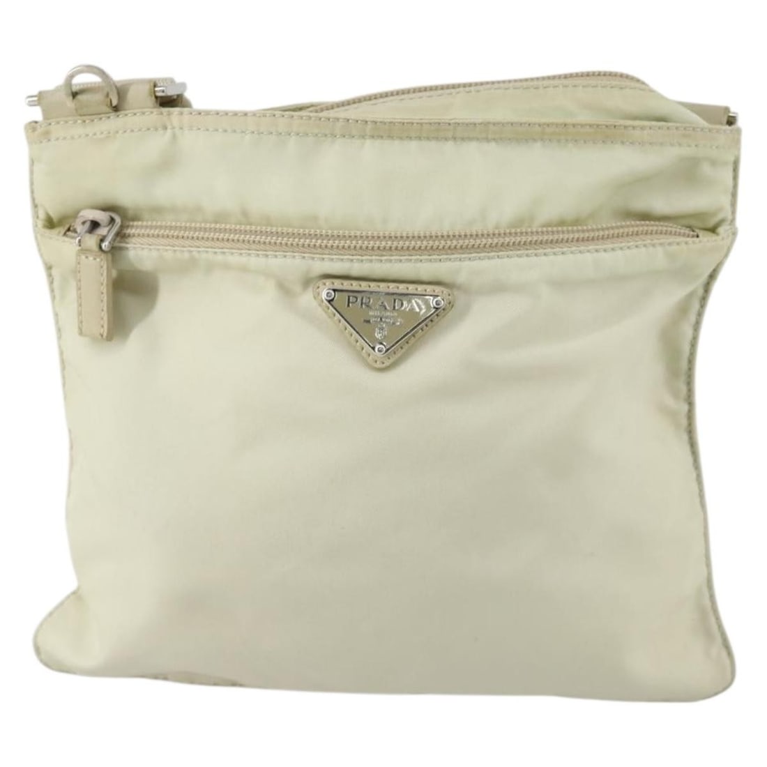 Beige Nylon Prada Messenger Bag with Front Pocket for Women: Beige Nylon Prada Messenger Bag with Front Pocket for Women This Prada Front Pocket Messenger Bag for women features a beige nylon construction with a practical front pocket design. The bag shows sign
