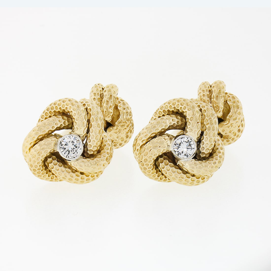 Tiffany & Co. 14k Yellow Gold Infinity Love Knot Cufflinks with Diamonds: Tiffany & Co. 14k Yellow Gold Infinity Love Knot Cufflinks with Diamonds Elevate your formal attire with these exquisite Tiffany & Co. cufflinks, crafted from solid 14k yellow gold. Each cufflink feat
