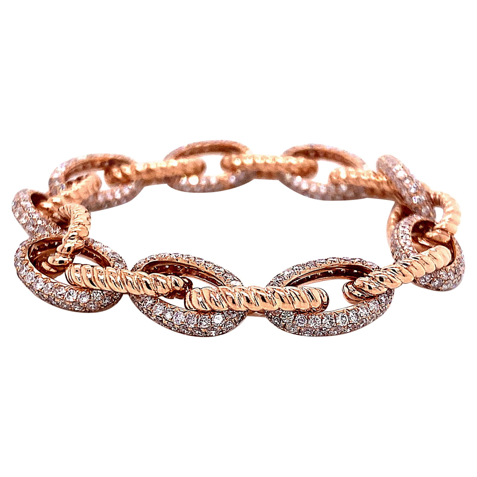 5.72ct Diamond Bracelet in 14k Rose Gold: 5.72ct Diamond Bracelet in 14k Rose Gold This stunning 5.72 Carat Diamond Link Bracelet is crafted in luxurious 14k rose gold, featuring a total of 640 round diamonds with an approximate G/H color and
