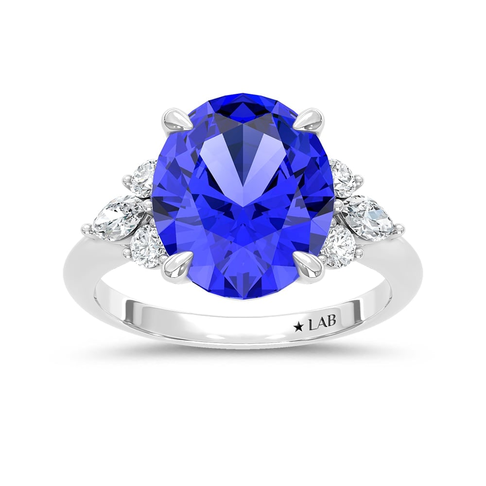 14K White Gold Lab Grown Diamond 7 1/8 Ct.Tw. Oval Shape Recrystalized Blue Sapphire Engagement Ring: 14K White Gold Lab Grown Diamond 7 1/8 Ct.Tw. Oval Shape Recrystalized Blue Sapphire Engagement Ring (Center 6 5/8 ct) Exude timeless sophistication with this 14K white gold engagement ring. Its cente
