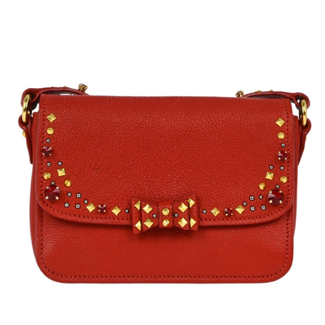 Red Matelasse Goatskin Small Miu Miu Crossbody Bag Model 194/A: Red Matelasse Goatskin Small Miu Miu Crossbody Bag Model 194/A This Miu Miu crossbody bag is crafted from red goatskin leather and features a matelasse finish. The small-sized bag has a top handle des