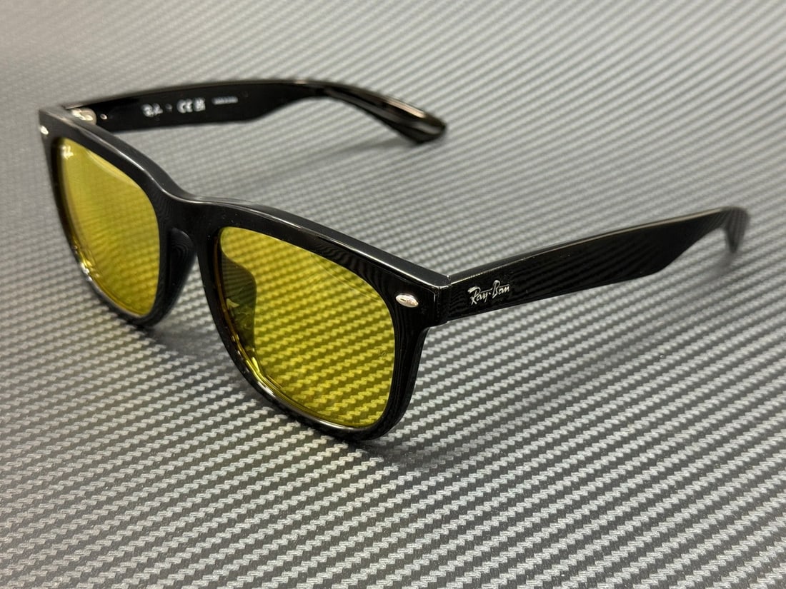 RAY BAN RB4260D Unisex Black Frame Yellow Lenses Sunglasses: RAY BAN RB4260D Unisex Black Frame Yellow Lenses Sunglasses Experience stylish protection with the RAY BAN RB4260D sunglasses. These unisex sunglasses feature a sleek black frame complemented by vibra
