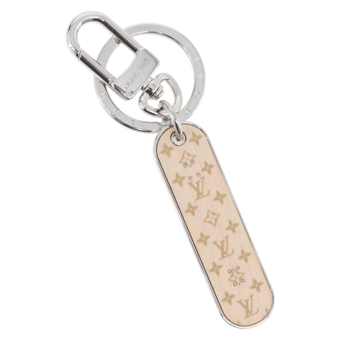 Beige Metal Porte Cres Skateboard Charm by Louis Vuitton MP3135: Beige Metal Porte Cres Skateboard Charm by Louis Vuitton MP3135 This Louis Vuitton Porte Cres Skate Board Charm is crafted from beige-toned metal and features a sleek, stylish design. Made in Italy, i