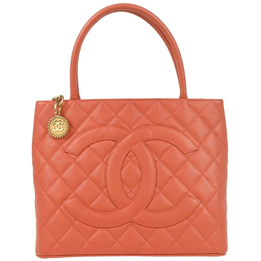 Chanel Salmon Pink Caviar Medallion Tote Handbag: Chanel Salmon Pink Caviar Medallion Tote Handbag Introducing the Chanel Salmon Pink Calfskin Medallion Tote Handbag, a stylish accessory that combines elegance and functionality. This medium-sized tot