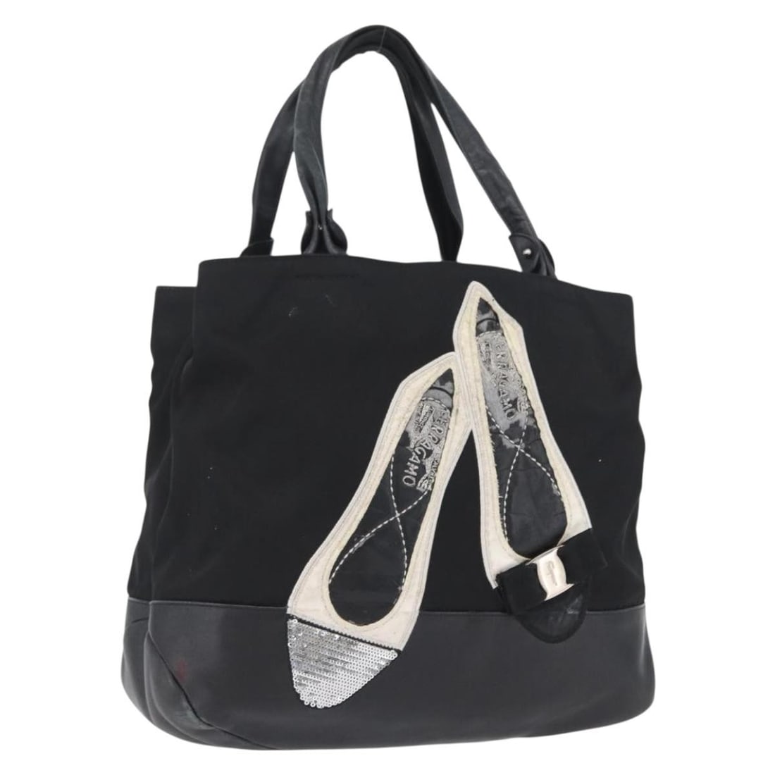 Salvatore Ferragamo Vala Black Nylon Women's Tote Handbag Silver Tone Italy: Salvatore Ferragamo Vala Black Nylon Women's Tote Handbag Silver Tone Italy This Salvatore Ferragamo Vala tote bag is crafted from black nylon with silver-tone accents. Designed for women, it offers a