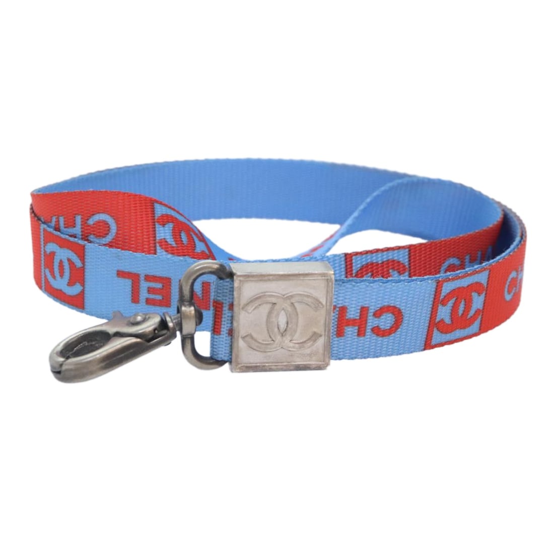 Blue Nylon Neck Strap with Silver Accents by CHANEL: Blue Nylon Neck Strap with Silver Accents by CHANEL This CHANEL neck strap features a blue and silver color scheme and is crafted from durable nylon material. Designed for women, it includes silver-to