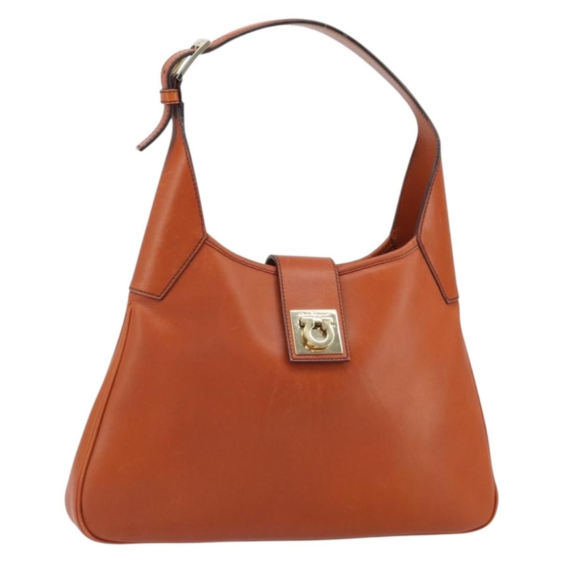 Salvatore Ferragamo Brown Leather Gancini Shoulder Bag with Dust Bag: Salvatore Ferragamo Brown Leather Gancini Shoulder Bag with Dust Bag This Salvatore Ferragamo Gancini shoulder bag features a brown leather exterior with gold-tone accents. Designed for women, the bag