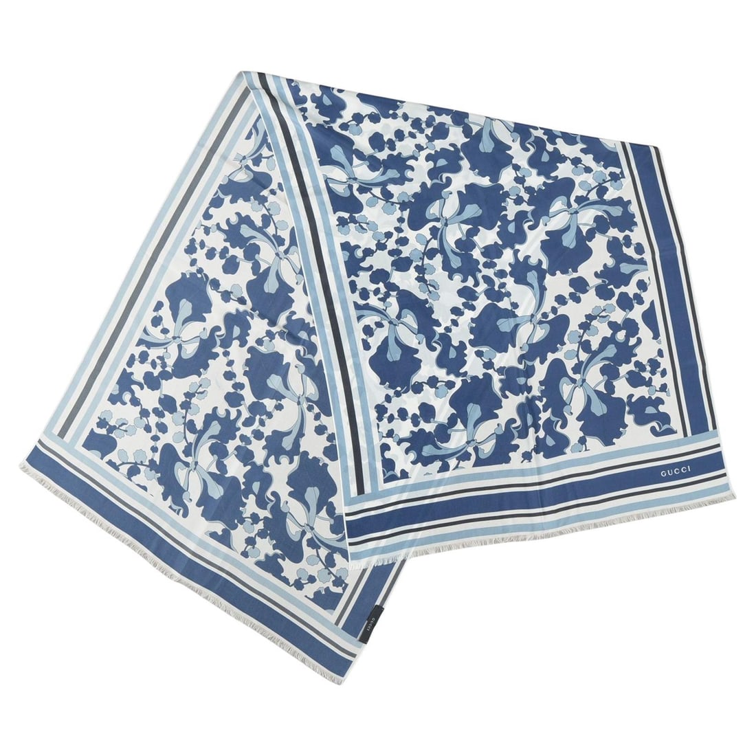 Abstract Floral Silk Scarf by Gucci in Blue and White: Abstract Floral Silk Scarf by Gucci in Blue and White This Gucci silk scarf features an abstract floral design in blue, celeste, and white. Crafted in Italy, it is made from high-quality silk and show