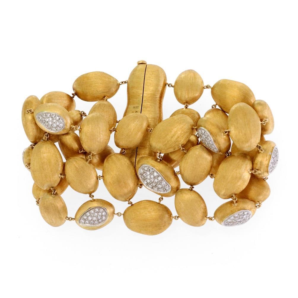 Marco Bicego Siviglia 1.30ct Diamond 18k Gold Triple Strand Bracelet: Marco Bicego Siviglia 1.30ct Diamond 18k Gold Triple Strand Bracelet Elevate your jewelry collection with this stunning Marco Bicego bracelet from the Siviglia Collection. This wide bracelet is expert