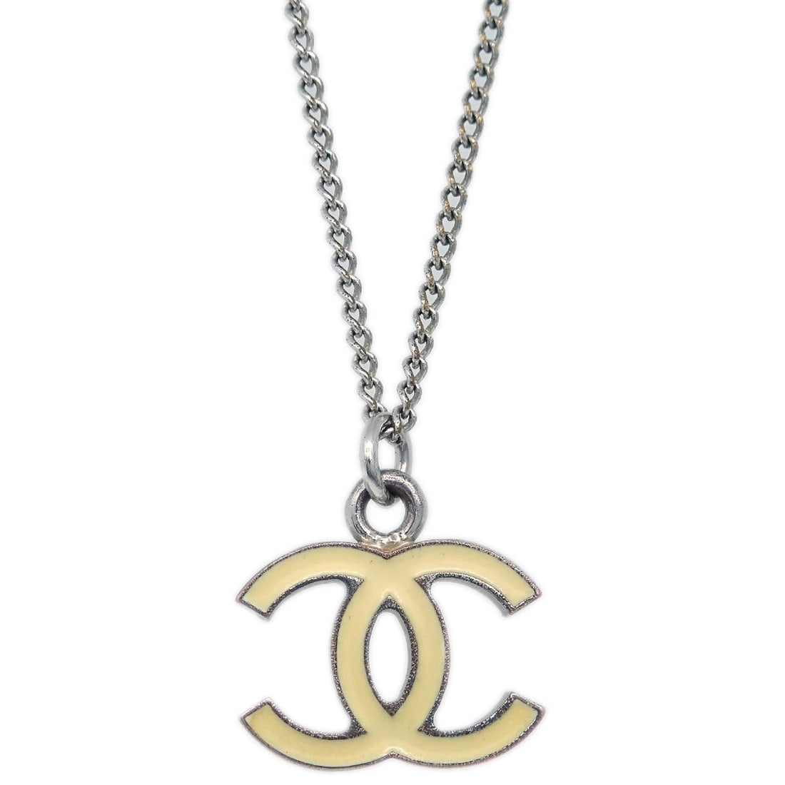Silver Plated Pendant Necklace by Chanel in White and Silver: Silver Plated Pendant Necklace by Chanel in White and Silver This Chanel chain necklace features a silver and white color palette with a pendant design. Made of silver-plated material, it showcases th