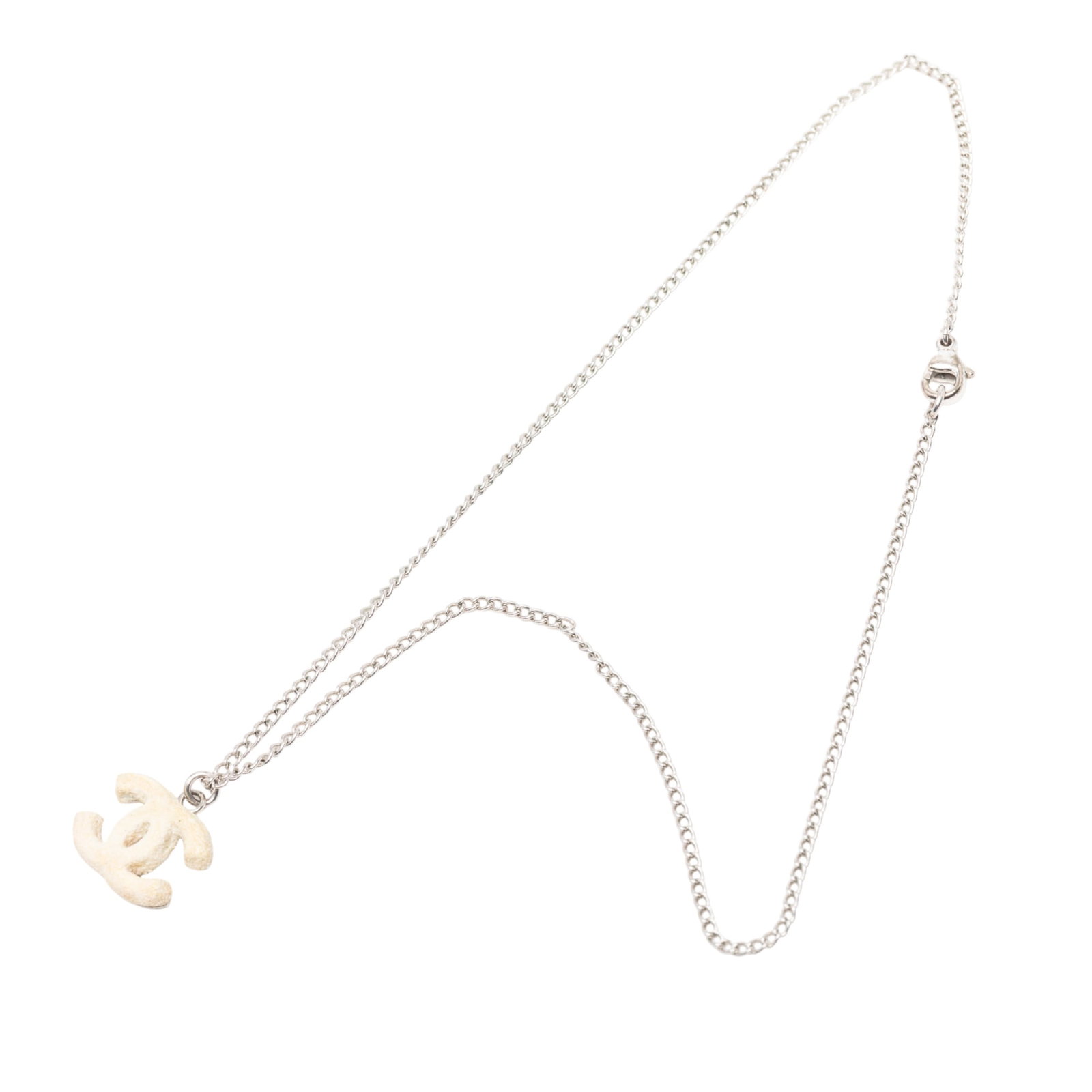 Textured CC Pendant Necklace in Silver Tone Metal by Chanel: Textured CC Pendant Necklace in Silver Tone Metal by Chanel This Chanel necklace features a silver-tone metal construction with a textured CC pendant and a lobster clasp closure. The necklace is categ