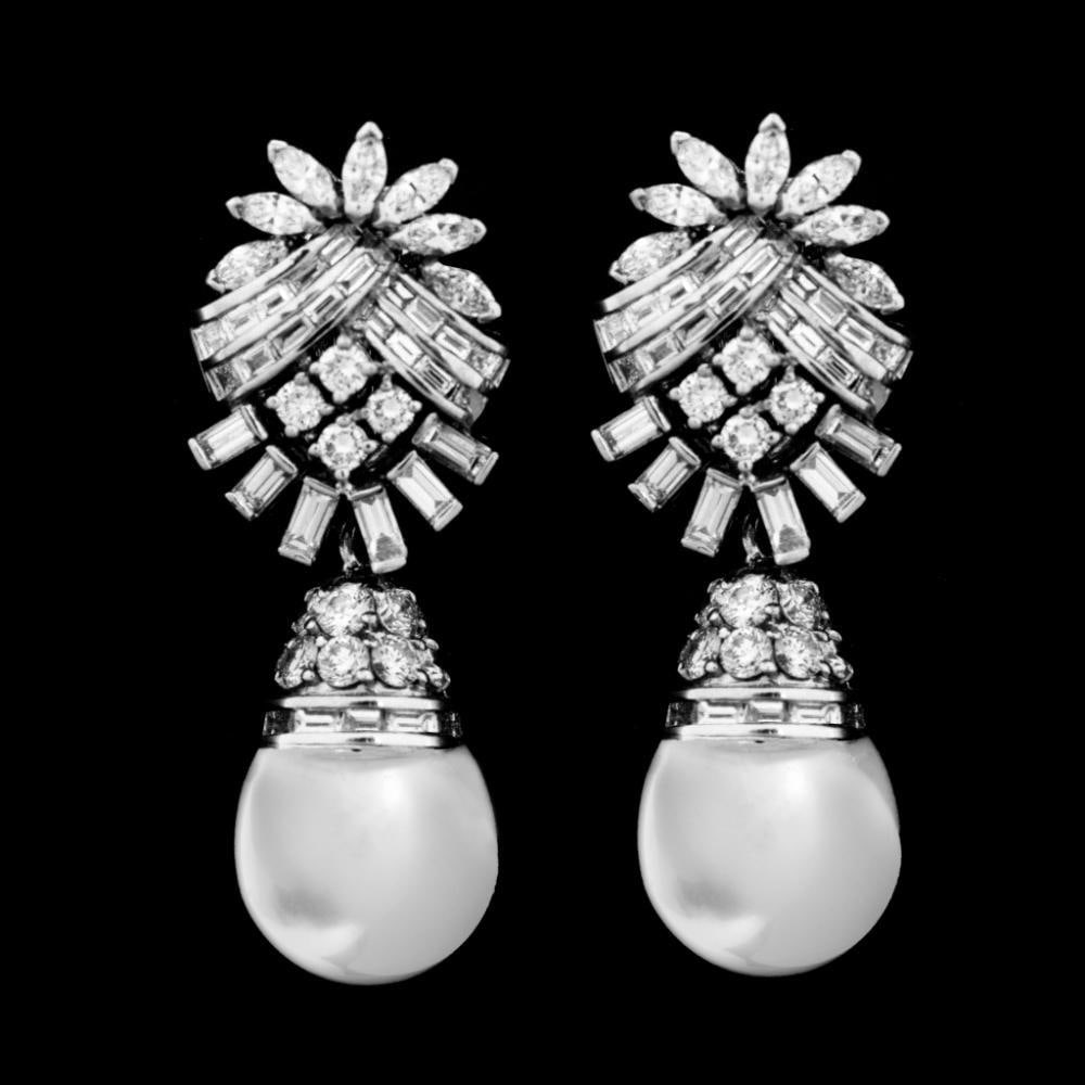 Art Deco Platinum Earrings with 2 South Sea Pearls and 130 Diamonds: Art Deco Platinum Earrings with 2 South Sea Pearls and 130 Diamonds These exquisite Art Deco earrings are crafted from platinum and feature stunning South Sea pearls paired with brilliant diamonds. Ea