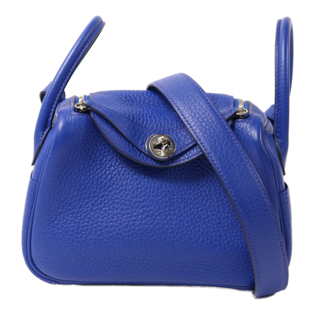 Hermes Mini Lindy Blue Clemence Leather PHW 2-Way Shoulder Bag: Hermes Mini Lindy Blue Clemence Leather PHW 2-Way Shoulder Bag This Hermes Mini Lindy 2-way shoulder bag is crafted from Taurillon Clemence calfskin leather in a vibrant blue shade. Designed for versa