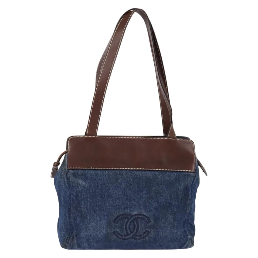 Vintage Chanel Denim and Leather CC Tote Bag 30cm x 28cm x 8cm: Vintage Chanel Denim and Leather CC Tote Bag 30cm x 28cm x 8cm This vintage Chanel CC tote is crafted from blue denim with leather accents, featuring a shoulder strap and metal fittings. The bag shows