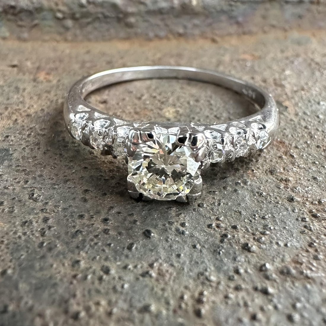 Vintage White Gold 0.68ctw Old Cut Diamond Solitaire Ring: Vintage White Gold 0.68ctw Old Cut Diamond Solitaire Ring This exquisite vintage engagement promise ring features a stunning solitaire design set in solid 13-14k white gold. The centerpiece is a natur