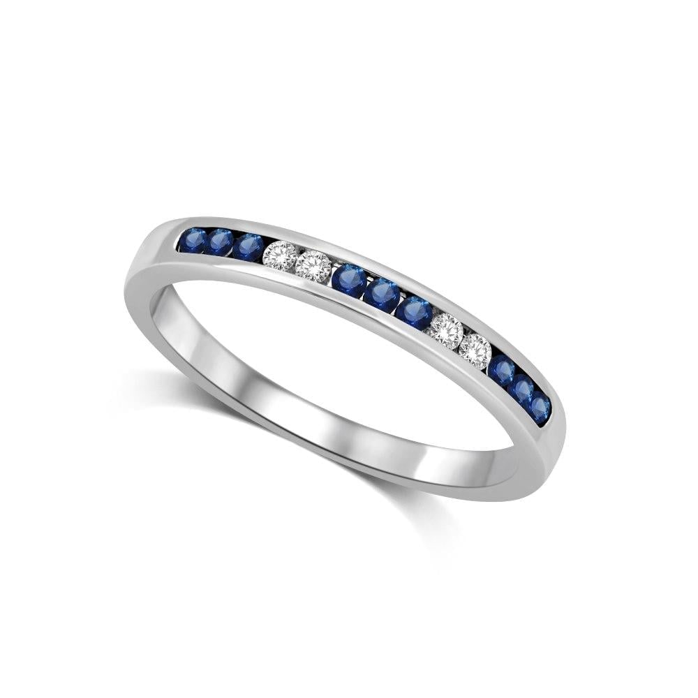 14K White Gold 1/5 Ct.tw Blue Sapphire & Diamond Machine Band: 14K White Gold 1/5 Ct.tw Blue Sapphire & Diamond Machine Band 14K White Gold Machine Band Set with 9 round cut 1/5 Ct.Tw. Blue Sapphires and 4 diamonds in channel setting. 14k White Gold Stone Color: