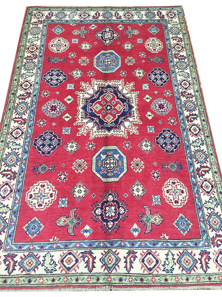 4' x 6' Handmade Afghan Kazak Wool Area Rug: 4' x 6' Handmade Afghan Kazak Wool Area Rug Free continental US Shipping Enhance your living space with the 4' x 6' Handmade Afghan Kazak Wool Rug, a stunning piece that brings cultural richness and a