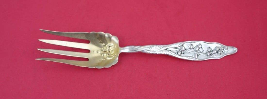 Whiting Sterling Silver Lily of the Valley Cold Meat Fork 8 7/8": Whiting Sterling Silver Lily of the Valley Cold Meat Fork 8 7/8" This exquisite cold meat fork is part of the Lily of the Valley pattern by Whiting, crafted from sterling silver. The design, patented