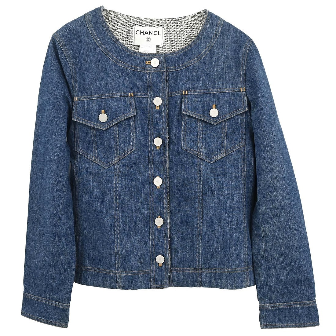 Chanel Vintage Blue Denim Collarless Button Jacket Size 40: Chanel Vintage Blue Denim Collarless Button Jacket Size 40 This Chanel single-breasted, collarless denim jacket is crafted from 100% cotton in a blue hue. Designed with long sleeves and a button closu