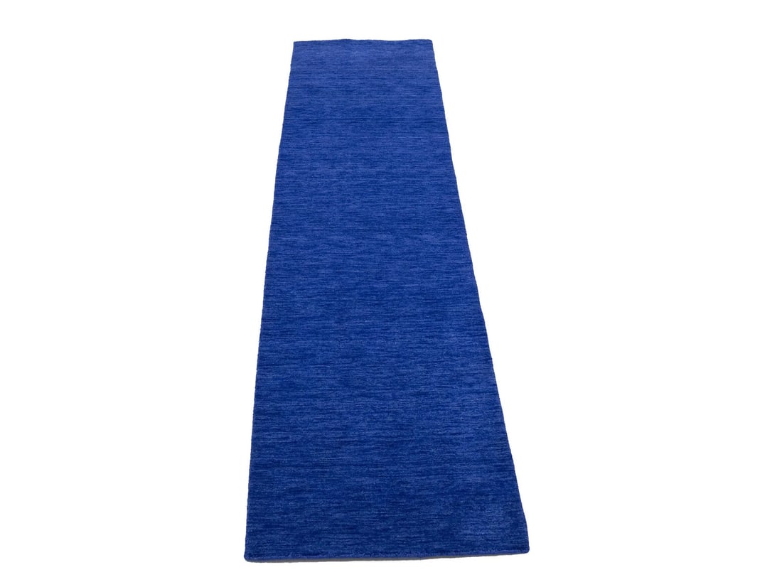 Royal Blue Wool Modern Runner Rug 2'6 x 9'10 Hand-Loomed from India: Royal Blue Wool Modern Runner Rug 2'6 x 9'10 Hand-Loomed from India This solid royal blue runner rug features a modern design and is hand-loomed from wool. Crafted in India, it offers a medium pile he