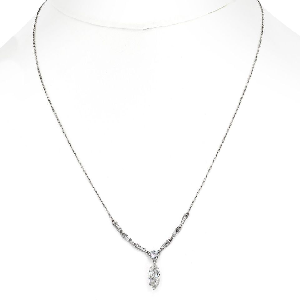 Tiffany & Co. Platinum 1.50cttw Marquise Drop Pendant Necklace: Tiffany & Co. Platinum 1.50cttw Marquise Drop Pendant Necklace This exquisite Tiffany & Co. pendant features a stunning marquise drop design, elegantly crafted in platinum. The pendant showcases an ap